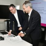 Axel Auweter (MEGWARE) and Prof. Philipp Neumann (HSU) signing record of delivery